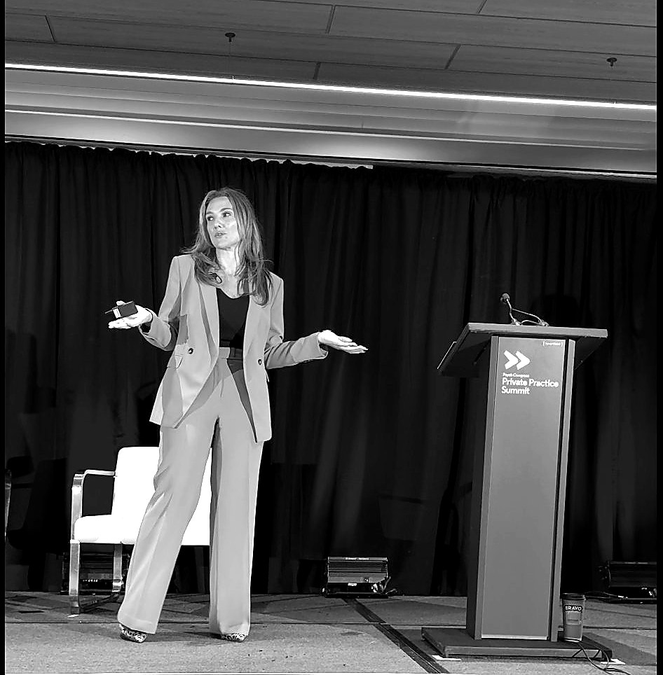 Edisa Shirley at conference panel, 2025